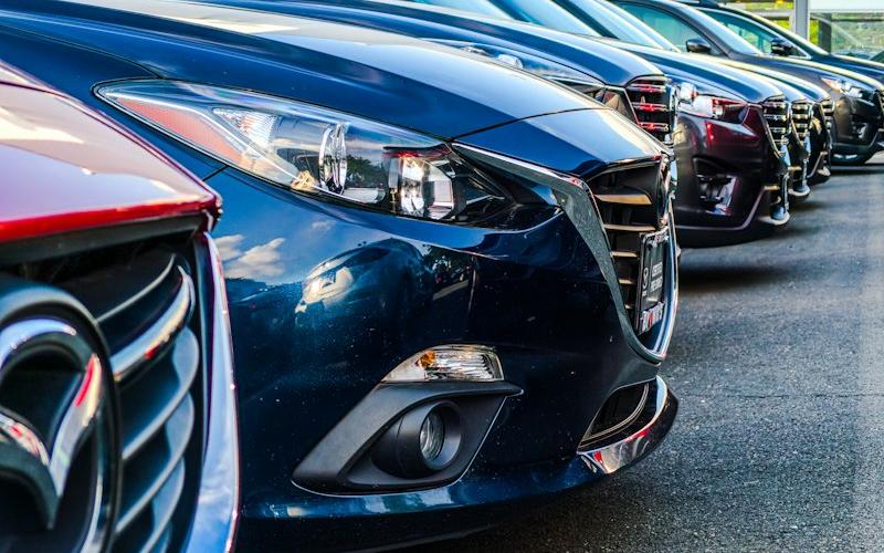 Row of vehicles at an automotive dealership