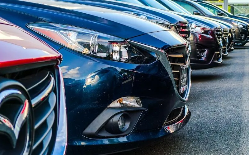 Row of vehicles at an automotive dealership