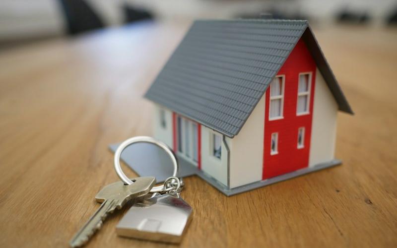 House model and keys representing real estate businesses