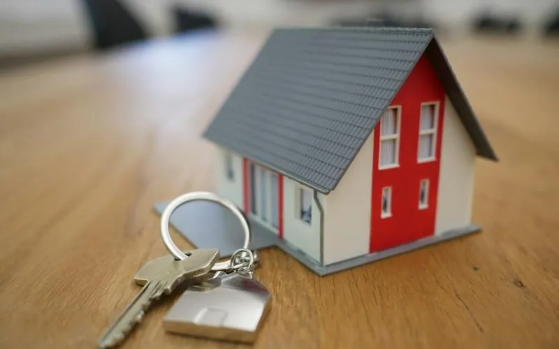 House model and keys representing real estate businesses